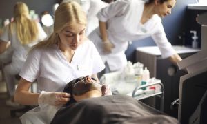 cosmetologist applying black mask on the face of a 2025 01 09 22 03 53 utc scaled f3648195